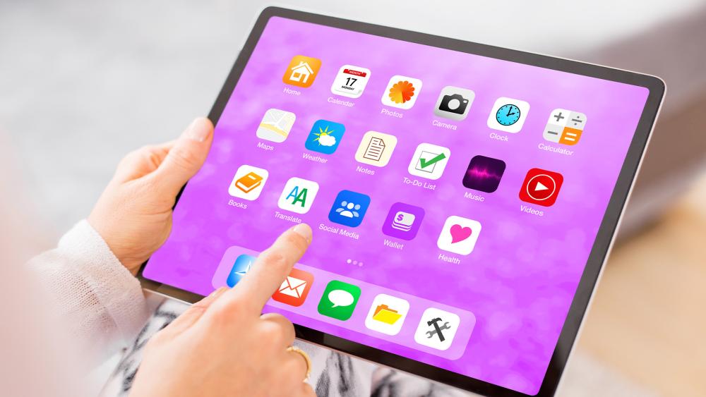 User using apps on a 10 inch tablet home screen