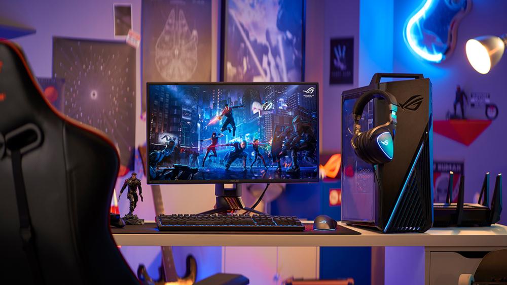 RGB gaming setup with monitor, PC, and headset on desk