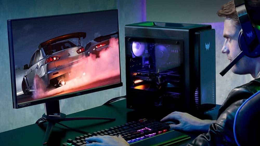 Gamer using Acer Nitro monitor with RGB PC and headset setup