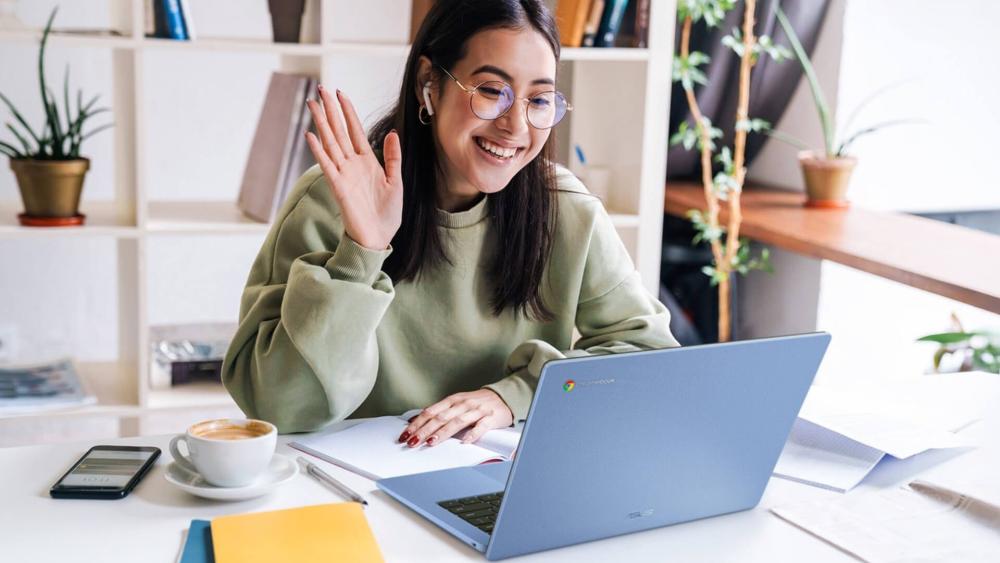 Woman using an Asus Chromebook Plus during an online video call