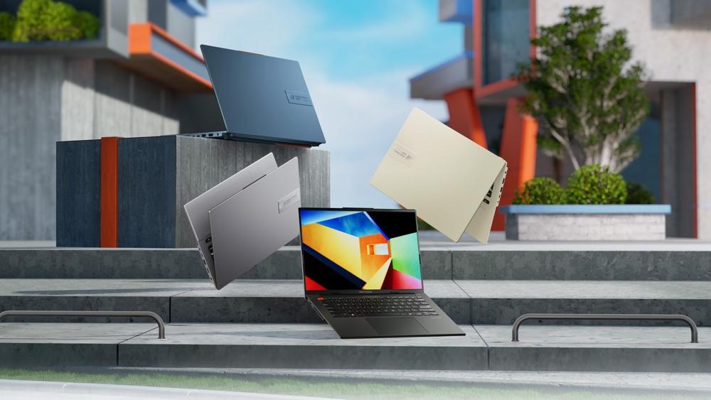 Multiple ASUS laptops displayed in a modern outdoor setting highlighting sleek design, colours and portability