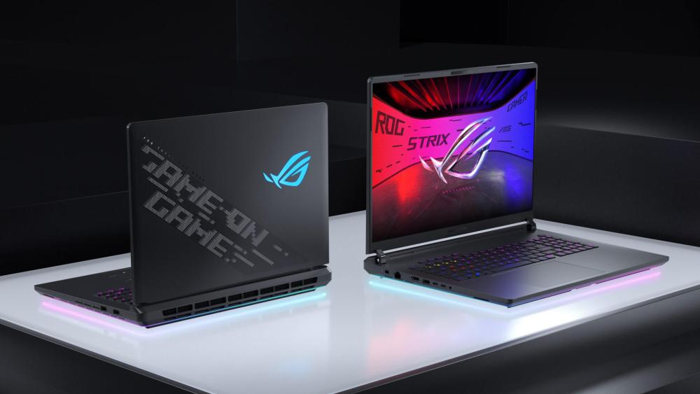 ASUS ROG Strix gaming laptop shown from front and back with RGB keyboard lighting and ROG logo design.