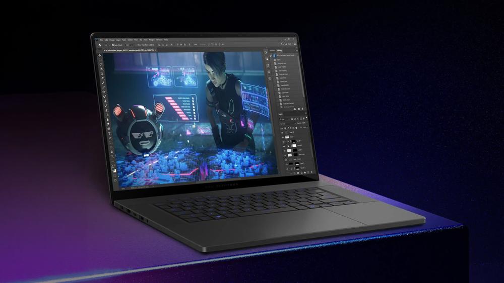 ASUS ROG Zephyrus laptop displaying creative design software with a futuristic digital artwork on the screen.
