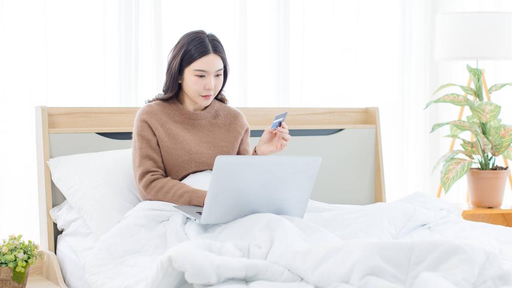 Professional using laptop for business work in office environment