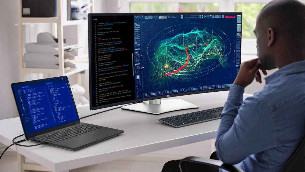 Dell business laptop connected to external monitor for productivity & data analysis