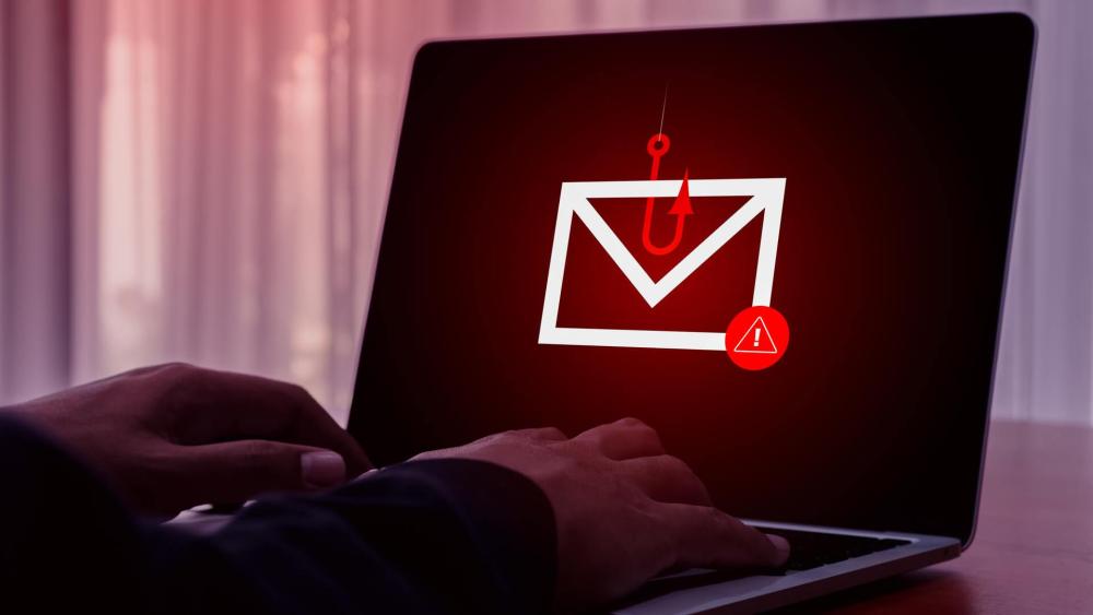 Laptop showing phishing scam warning symbol