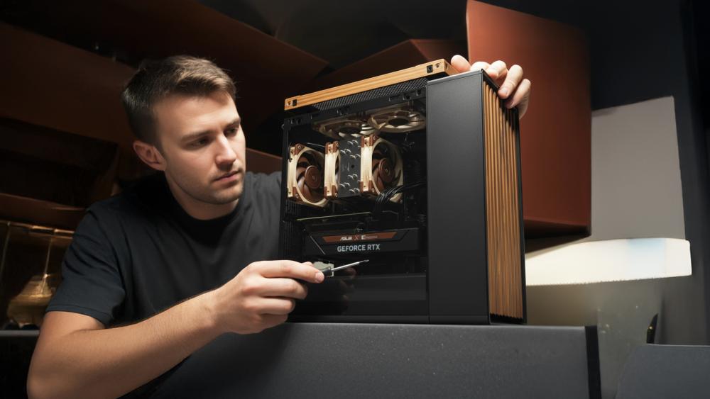 User adjusting Fractal case panel fit near GPU installation