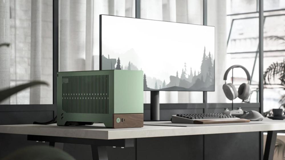 Compact Fractal Era PC case in a modern desk workspace