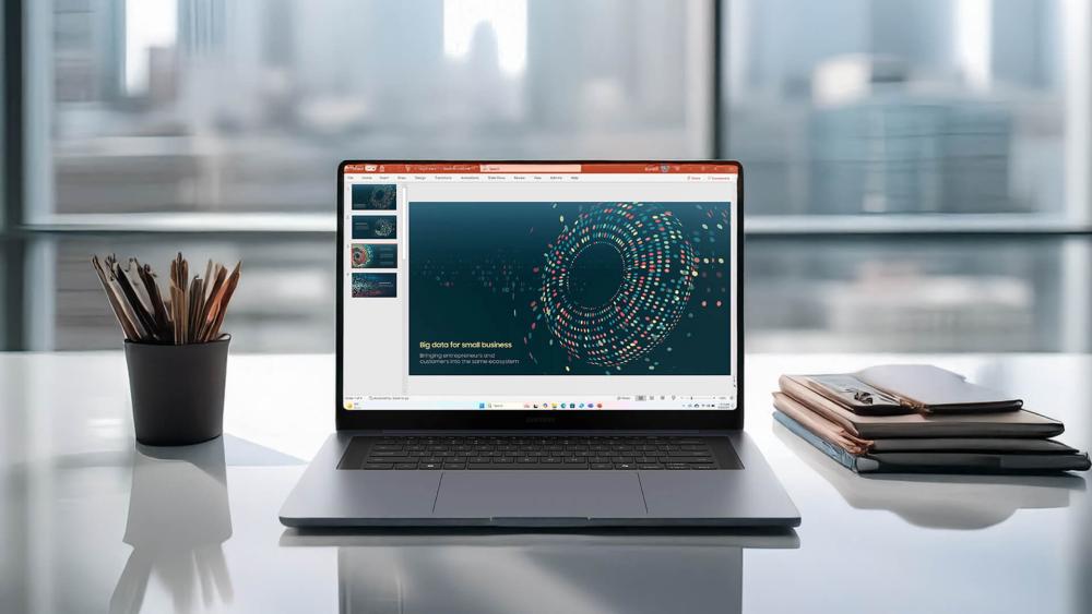 Samsung Galaxy Book laptop on a minimalist desk with abstract interface