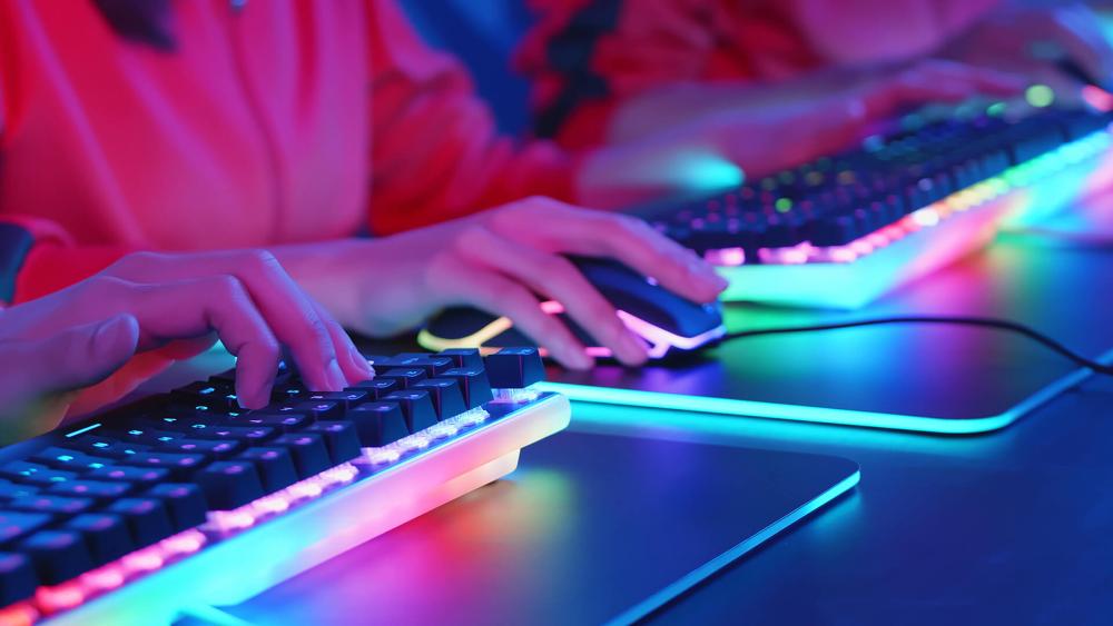 RGB keyboard and gaming mouse close-up on desk