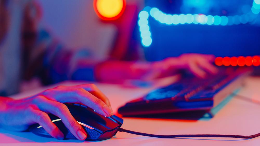 Gamer using mouse and keyboard showing real gameplay tracking movement