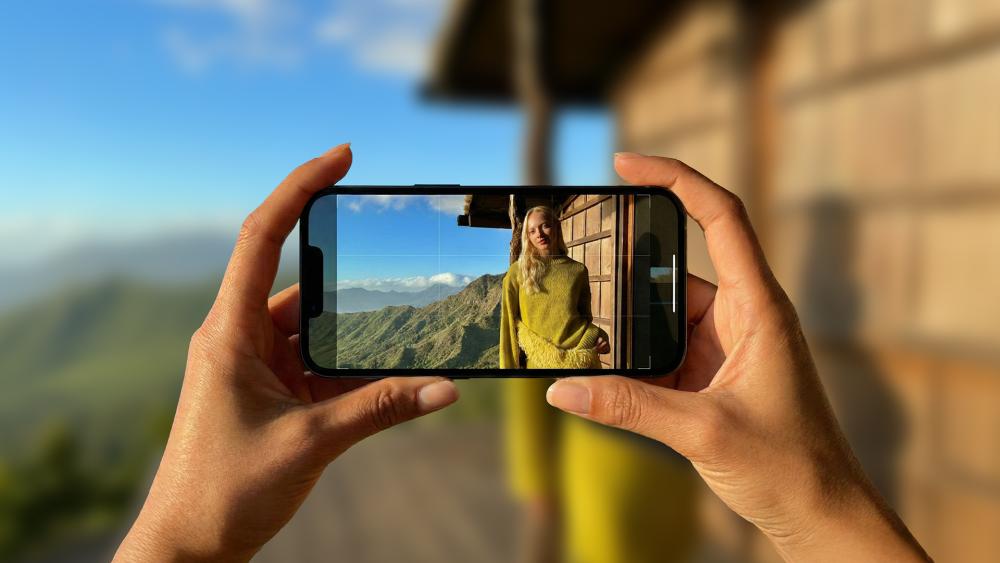 Person taking outdoor photo using iPhone camera