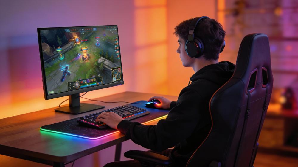 PC gamer playing game on a bright, colour-accurate monitor