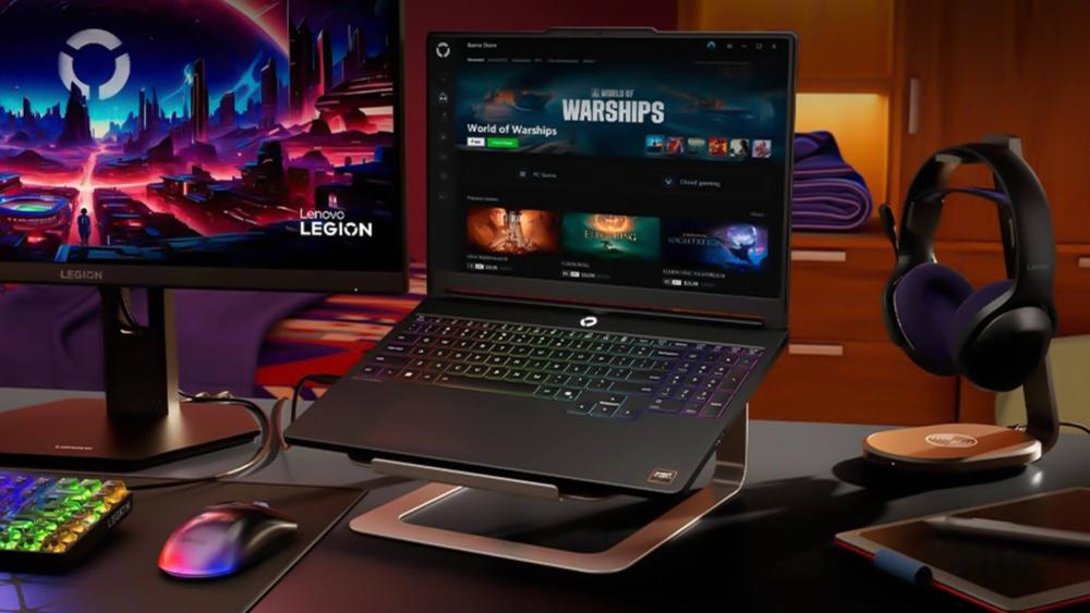 Lenovo Legion gaming laptop on a desk with an external monitor, headset, mouse and RGB accessories in a gaming setup.