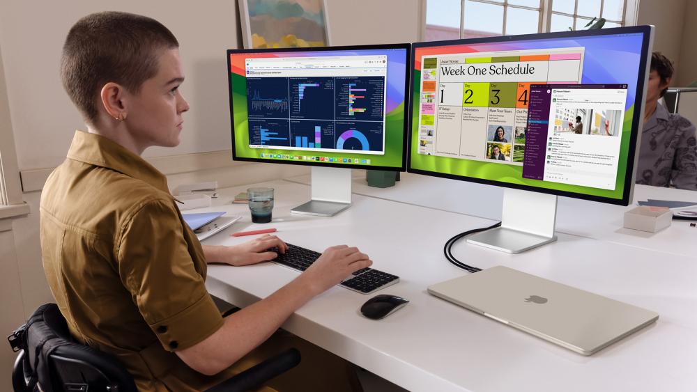 MacBook Air with dual monitors showing productivity workspace