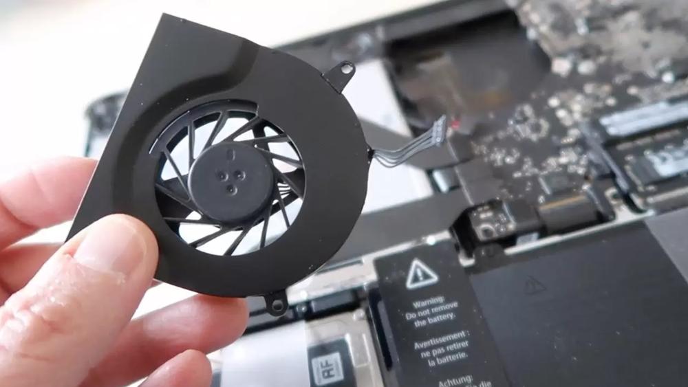 MacBook Pro internal fan showing cooling hardware and airflow design