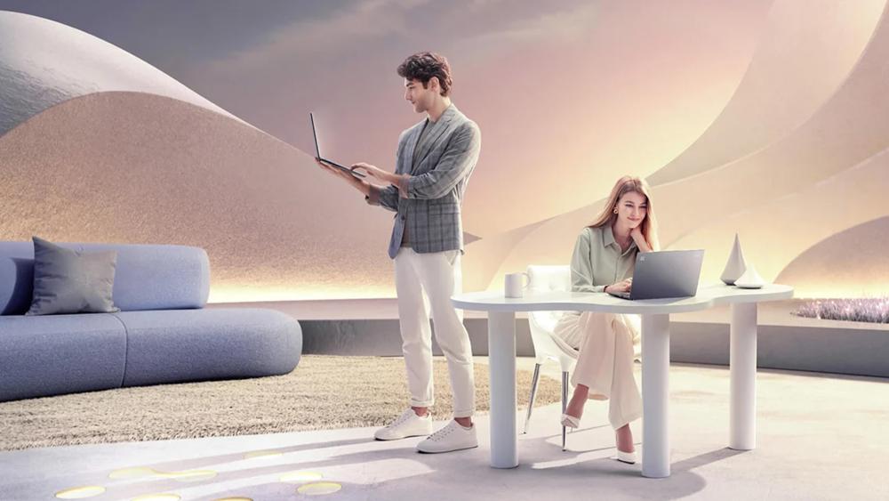 Two people using laptops in a stylish modern workspace, highlighting remote productivity, flexibility and everyday computing use