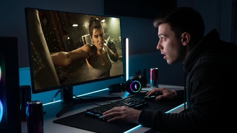 Player reacting to high-detail next-gen game graphics on a monitor.
