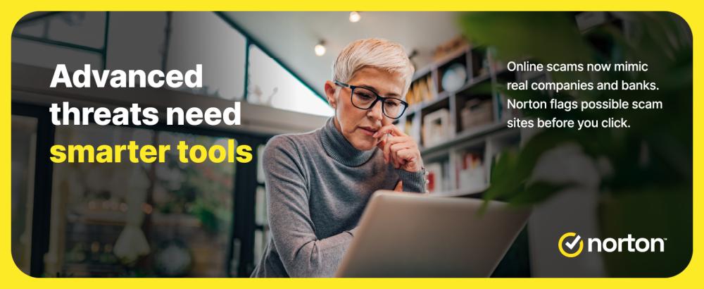 User checking laptop as Norton blocks advanced online scam threats
