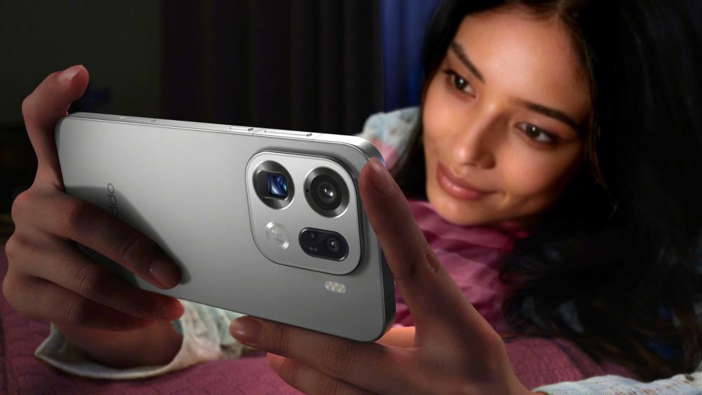 Woman holding the Oppo Find X9 Pro while watching videos