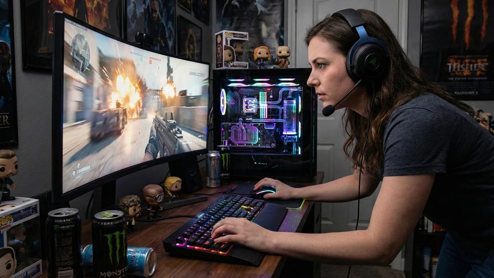 PC gamer using headset at RGB desktop setup