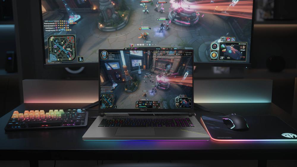 ROG Strix gaming laptop connected to dual-screen esports setup