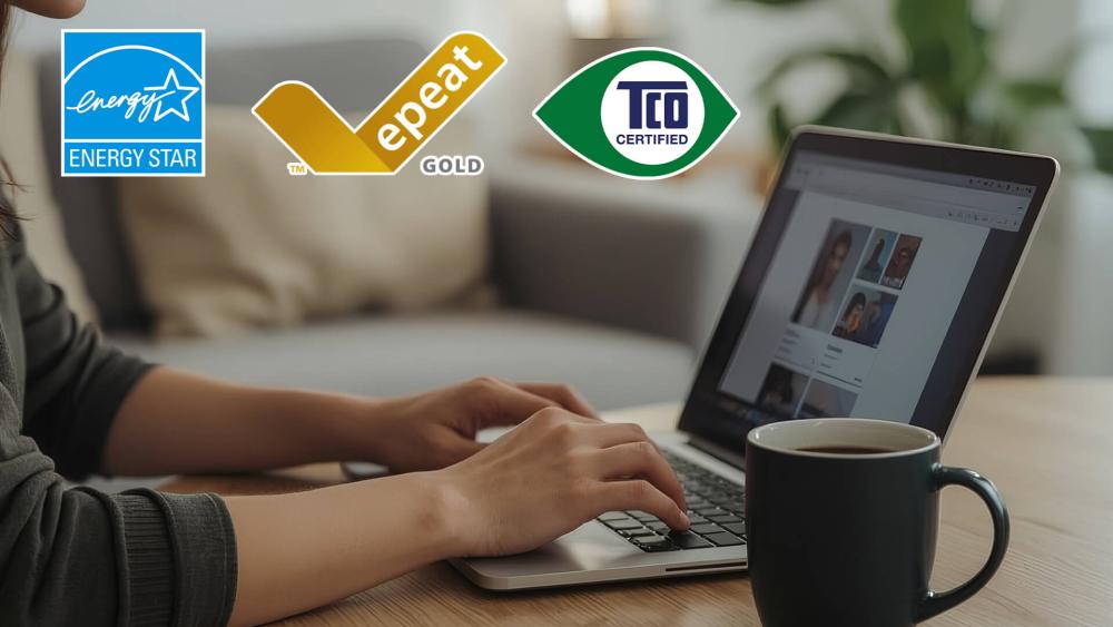Person using a laptop with Energy Star, EPEAT Gold, and TCO Certified logos