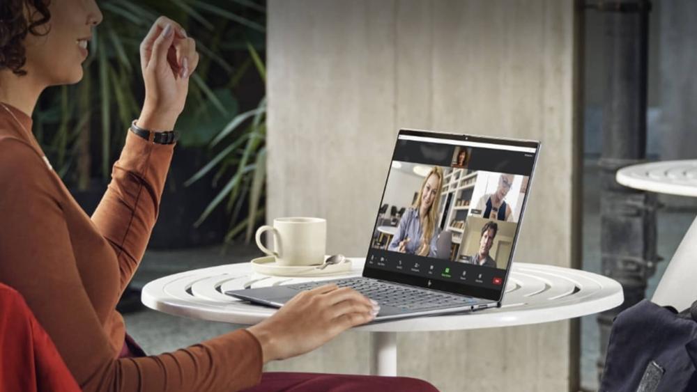Hybrid worker on a video call using an HP EliteBook laptop