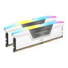 Corsair Vengeance RGB White DDR5 32GB RAM kit installed on a motherboard with glowing RGB lights.